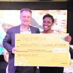 Wim Vanhelleputte CEO MTN Uganda handsover a Shs310m cheque to The Innovation Village as part of partnership that will see the telecom provide high speed internet and server for technology hu