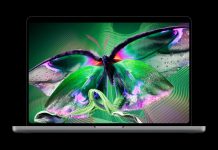 Apple brings OLED and touch to MacBook Pro, with prices from $2,899 MacBook Pro with PROLED XDR Display showing a colourful butterfly.