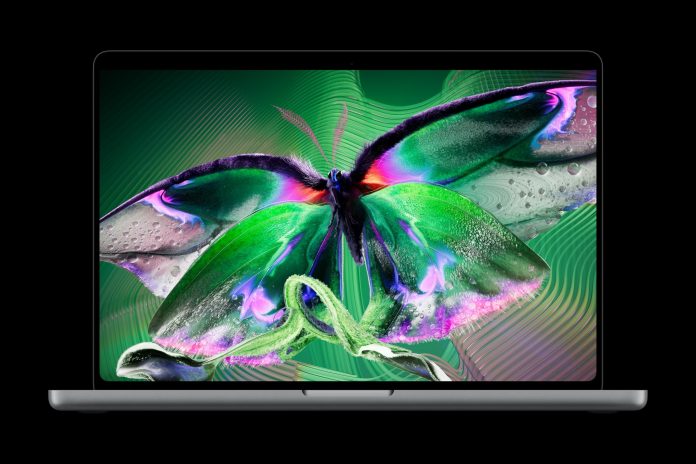 MacBook Pro with PROLED XDR Display showing a colourful butterfly.